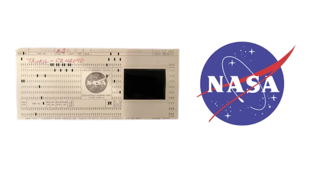 The image depicts the original computer punchcards used by NASA for their moon mission.